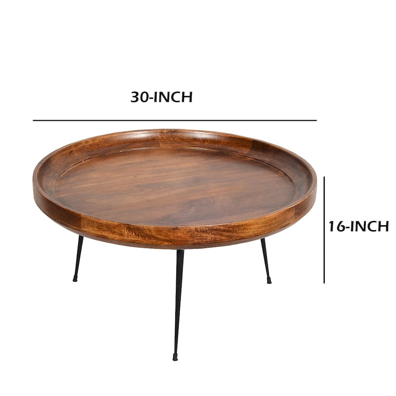 Table basse ronde en bois de manguier brun et noir avec pieds métalliques évasés