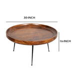 Table basse ronde en bois de manguier brun et noir avec pieds métalliques évasés