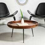 Table basse ronde en bois de manguier brun et noir avec pieds métalliques évasés